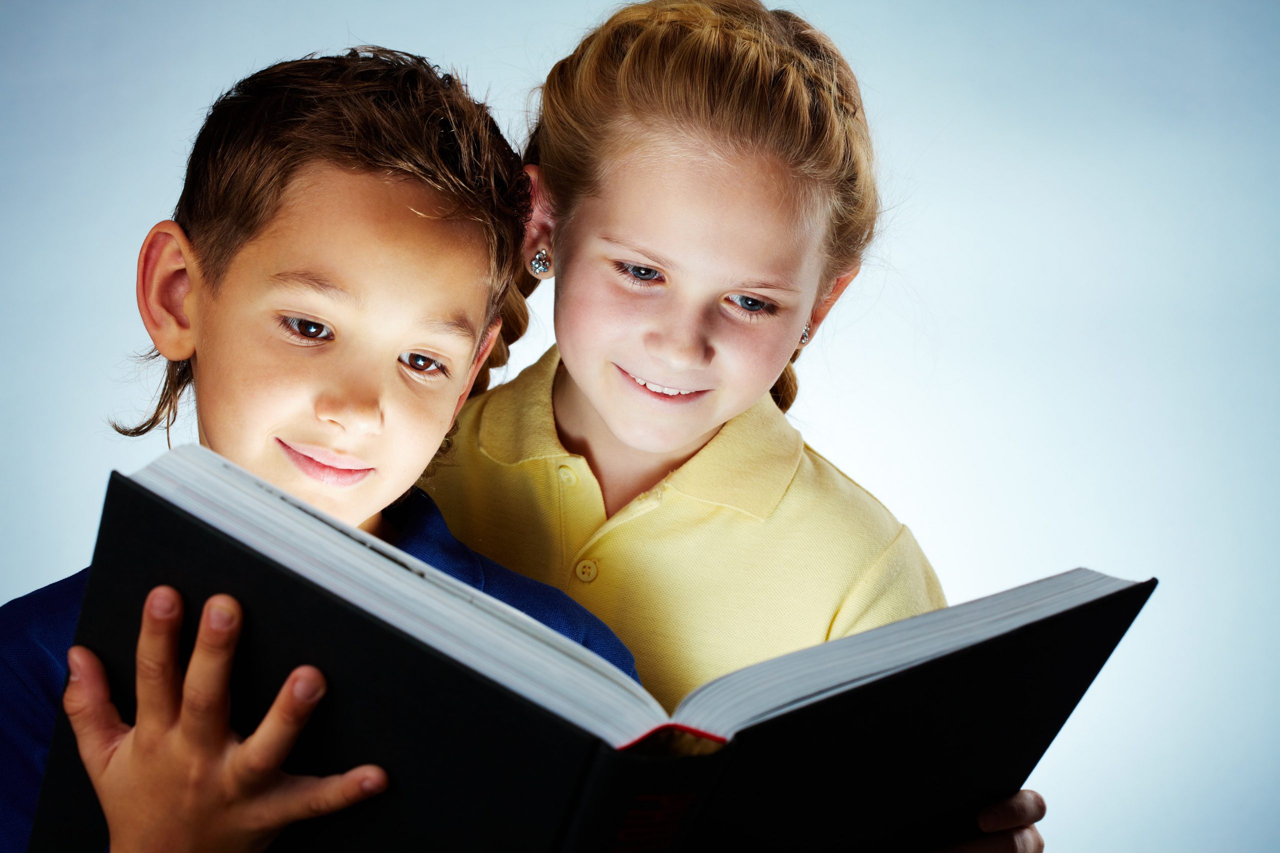graphicstock-image-of-smart-children-reading-interesting-book_HT6PqNWEW-min